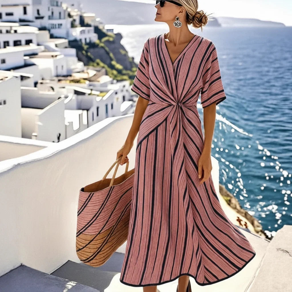 Women's maxi dress with V-neck and twisted front.